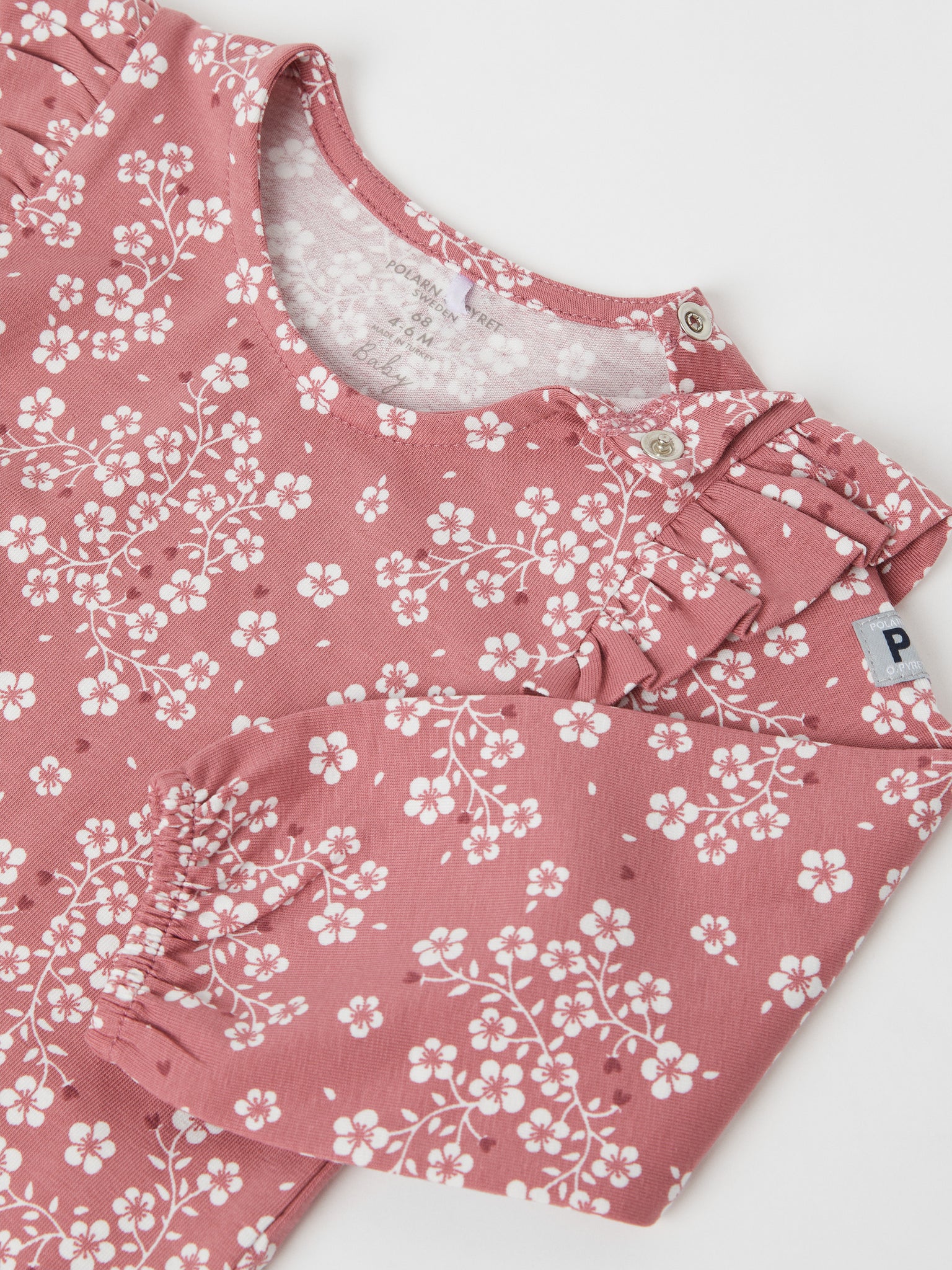 Organic Cotton Pink Floral Babygrow from the Polarn O. Pyret baby collection. Nordic baby clothes made from sustainable sources.