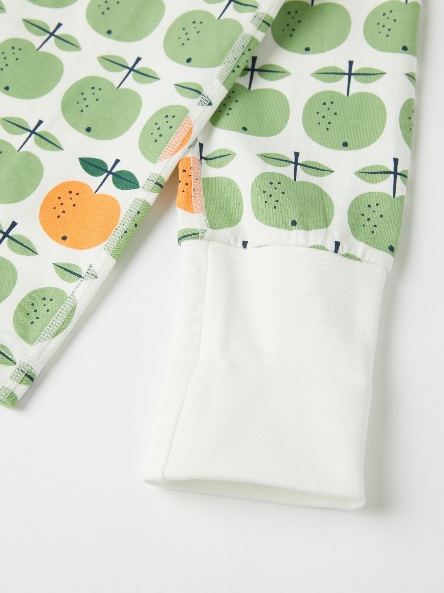 Apple Print Kids Pyjamas from the Polarn O. Pyret kidswear collection. Ethically produced kids clothing.