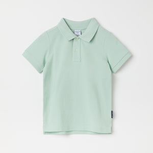 Green Kids Polo Shirt from the Polarn O. Pyret kidswear collection. Nordic kids clothes made from sustainable sources.