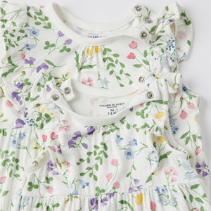 Pretty Ditsy Floral Cotton Baby Playsuit from the Polarn O. Pyret baby collection. Ethically produced kids clothing.