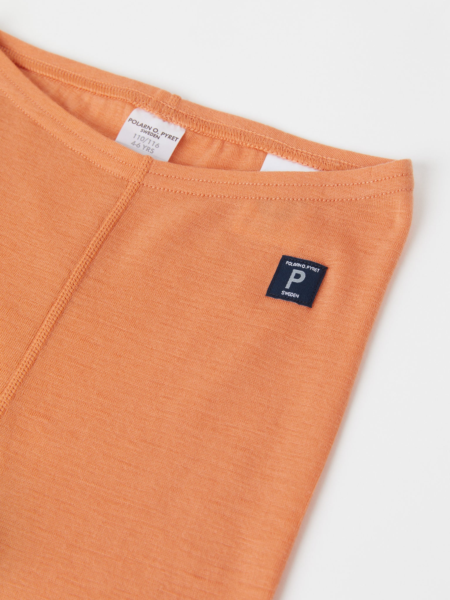 Orange Merino Kids Thermal Leggings from the Polarn O. Pyret outerwear collection. Ethically produced kids outerwear.