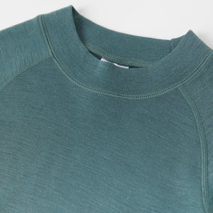 Green Merino Wool Kids Thermal Top from the Polarn O. Pyret outerwear collection. Made using ethically sourced materials.
