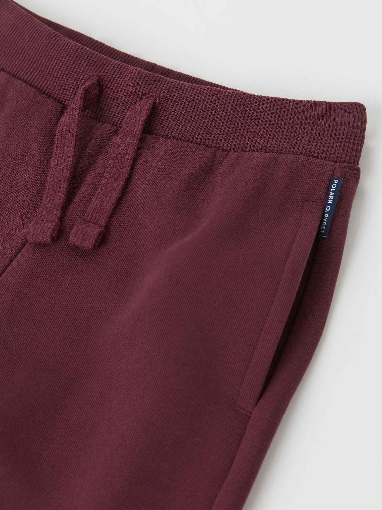 Organic Cotton Burgundy Kids Joggers from the Polarn O. Pyret kidswear collection. Nordic kids clothes made from sustainable sources.