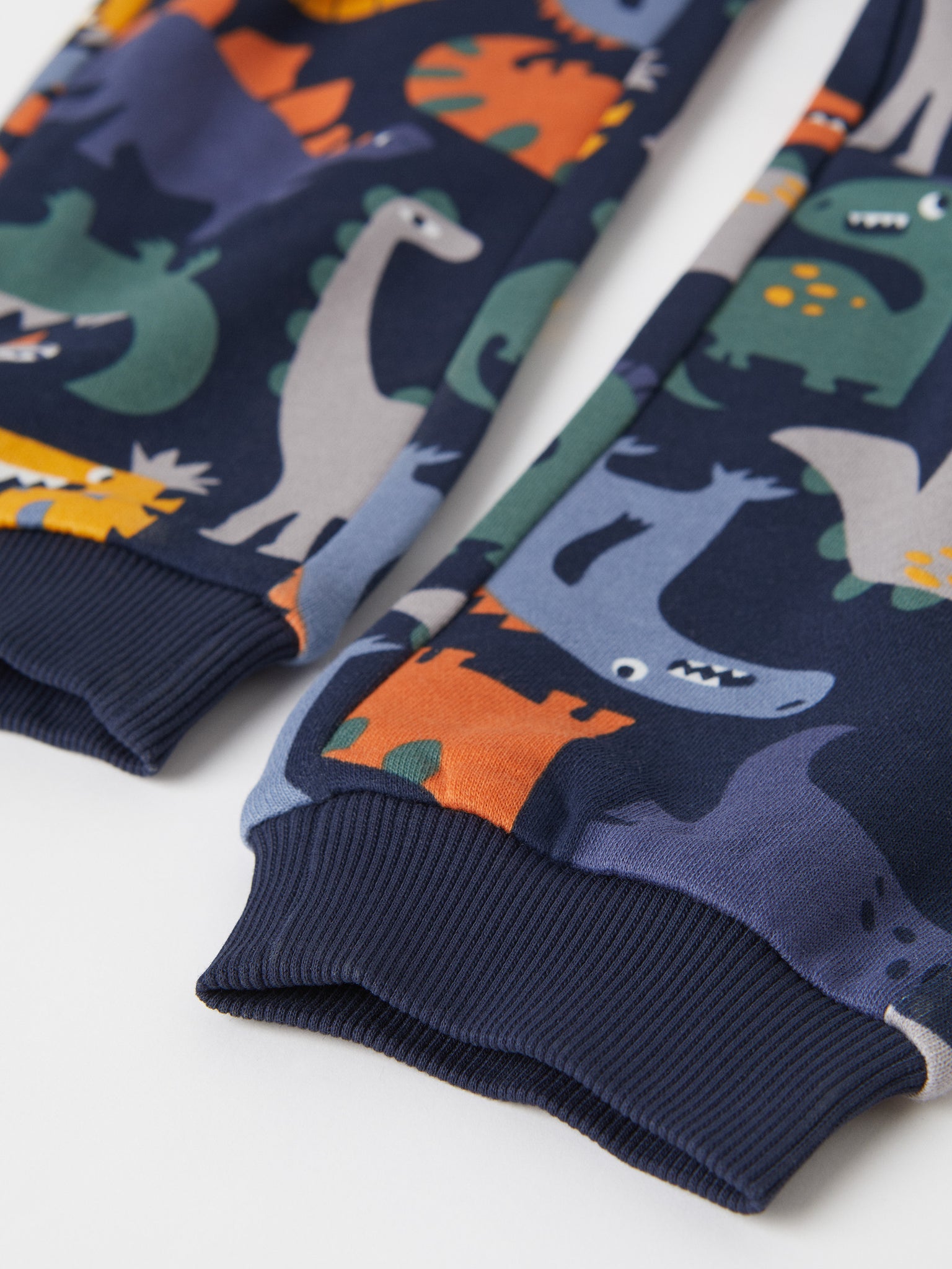 Cotton Dinosaur Print Kids Joggers from the Polarn O. Pyret kidswear collection. Clothes made using sustainably sourced materials.
