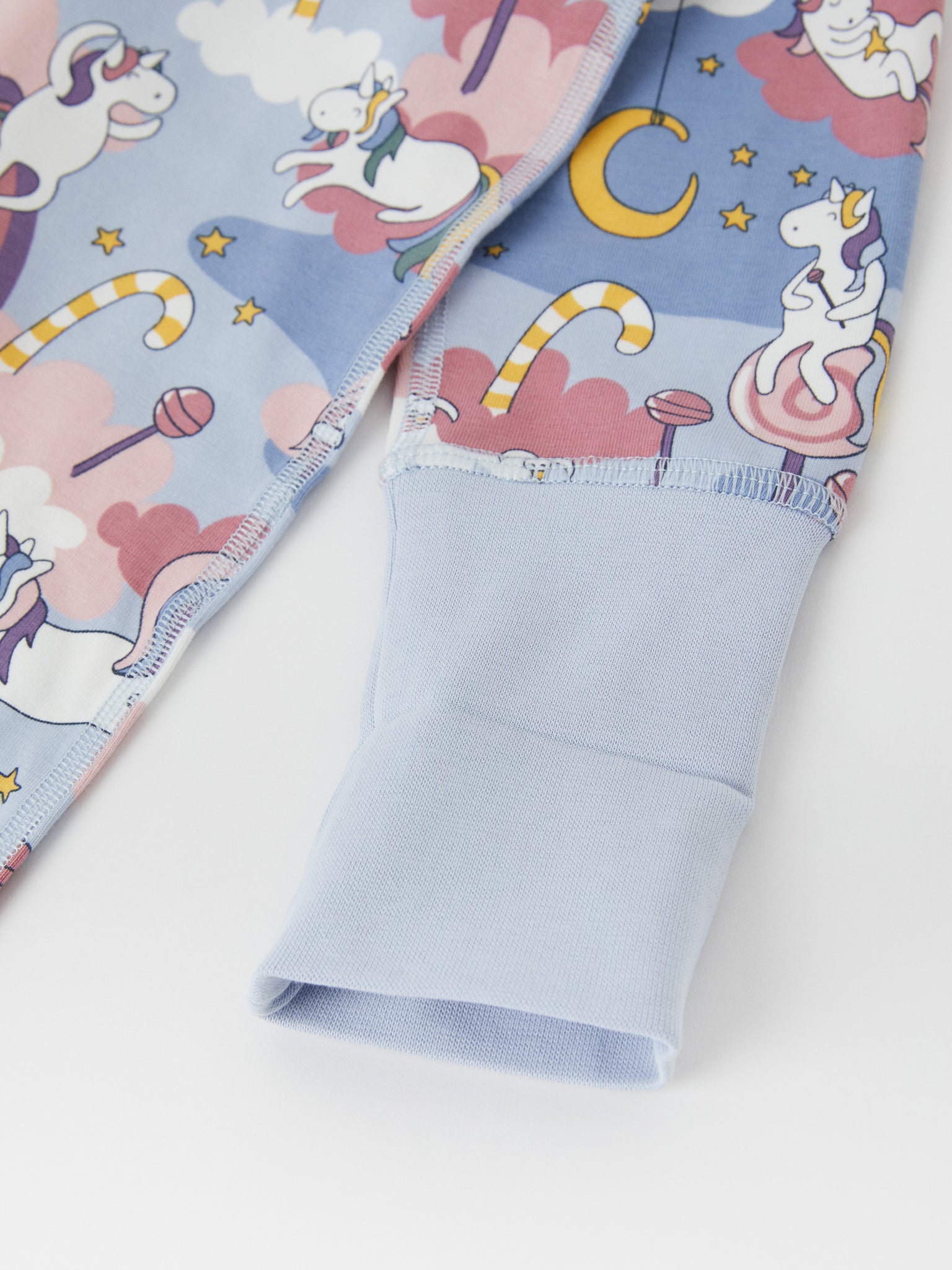 Cotton Unicorn Print Baby Sleepsuit from the Polarn O. Pyret baby collection. Clothes made using sustainably sourced materials.