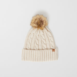 Wool Kids Beige Bobble Hat from the Polarn O. Pyret outerwear collection. Kids outerwear made from sustainably source materials