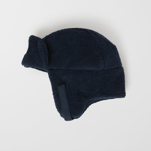 Merino Wool Navy Kids Bobble Hat from the Polarn O. Pyret outerwear collection. Made using ethically sourced materials.