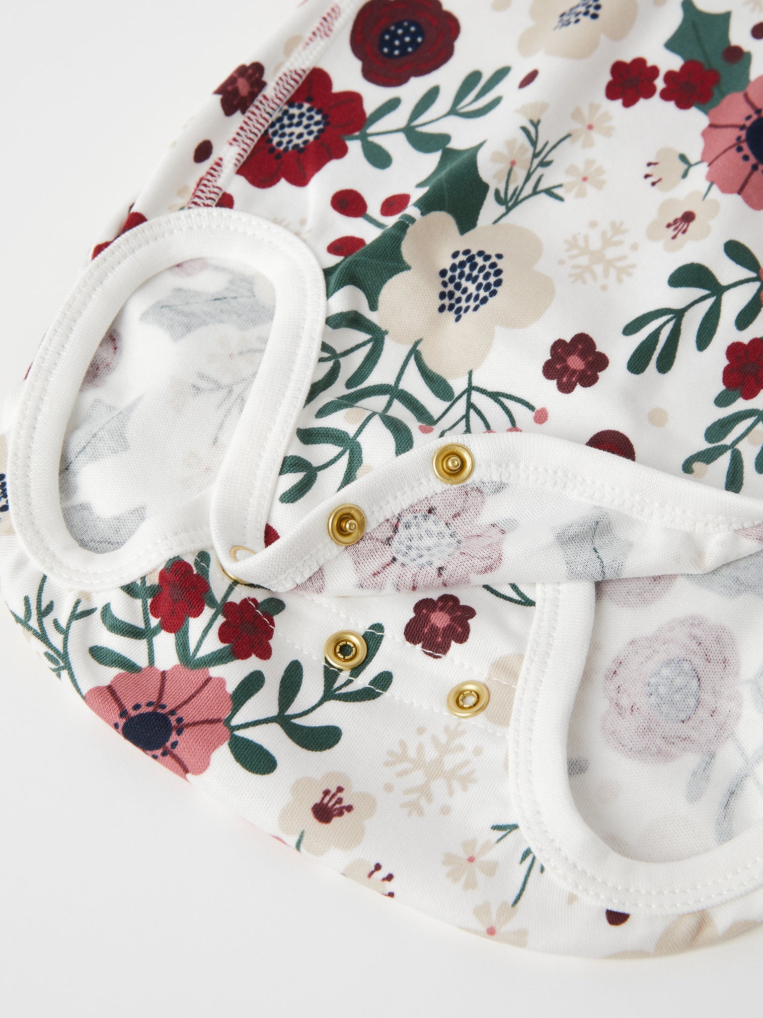 Xmas Floral Organic Cotton Babygrow from the Polarn O. Pyret baby collection. Nordic baby clothes made from sustainable sources.