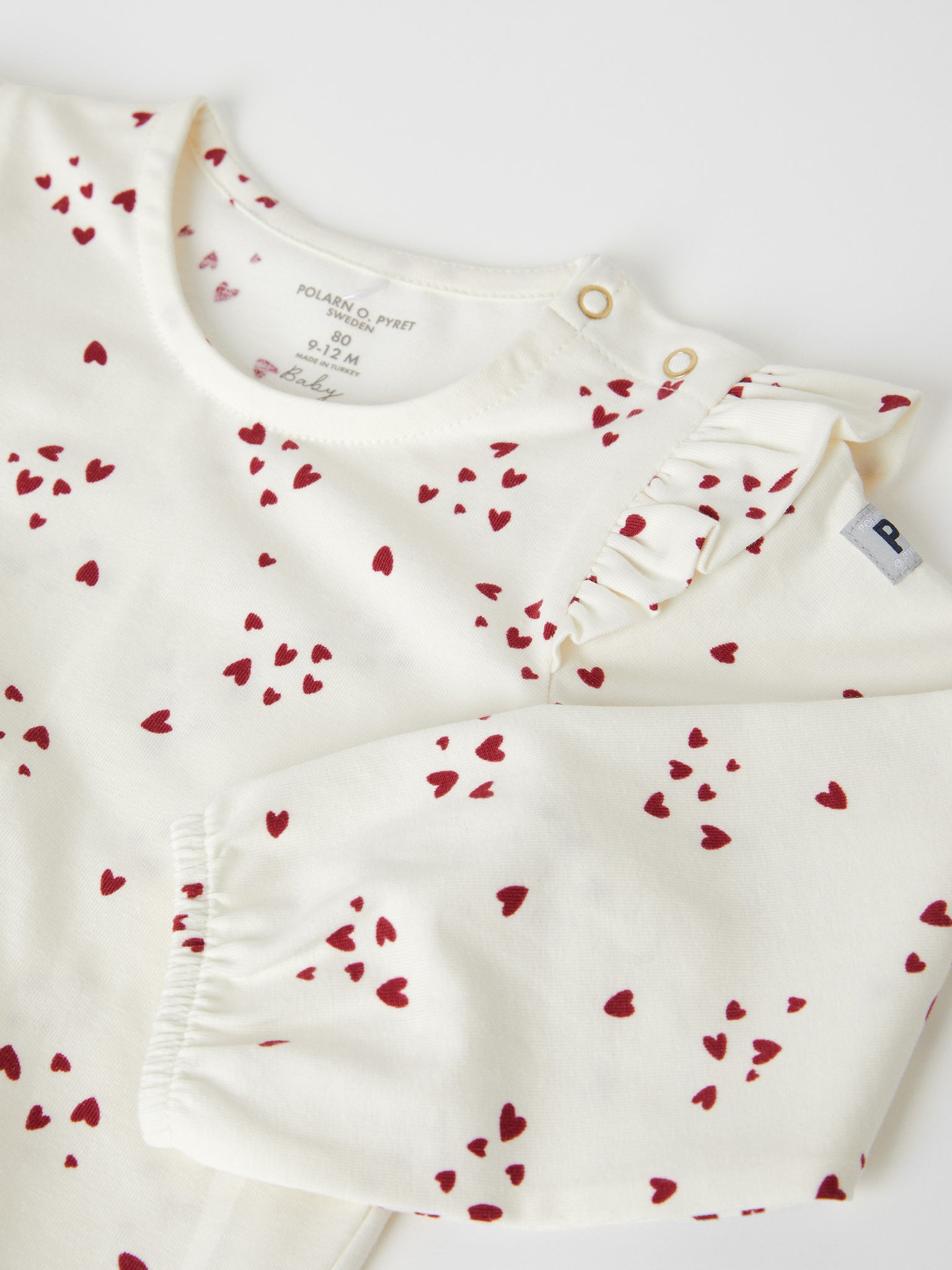 Heart Print Organic Cotton Babygrow from the Polarn O. Pyret baby collection. The best ethical baby clothes