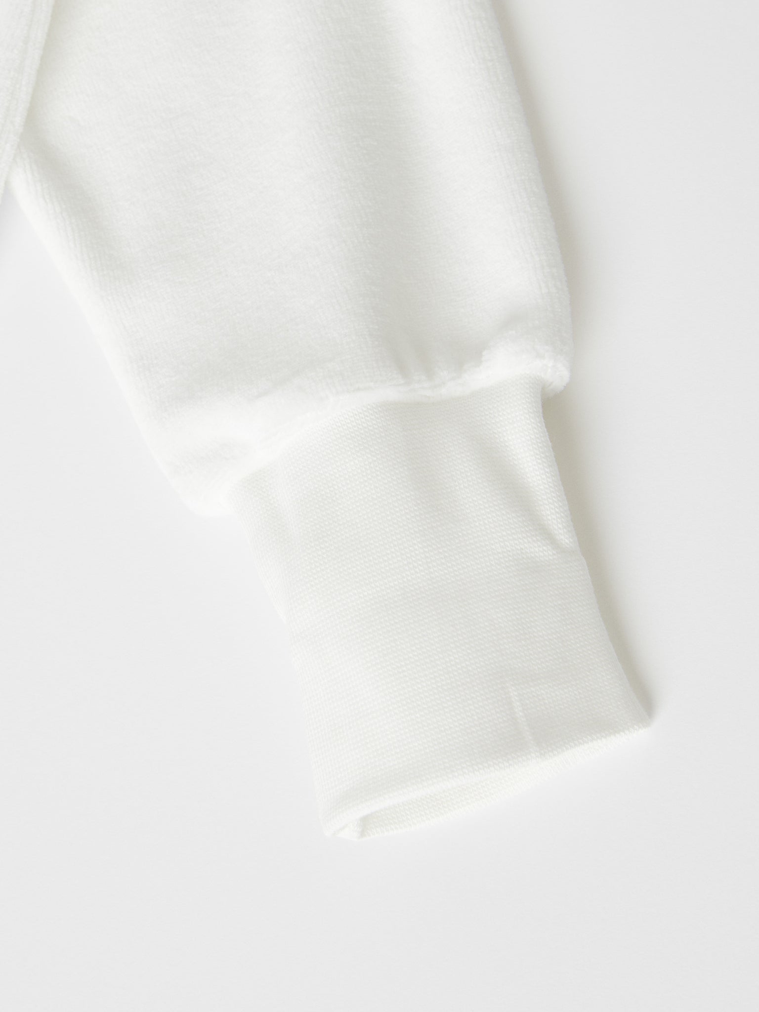 White Velour Baby Top from the Polarn O. Pyret baby collection. Nordic baby clothes made from sustainable sources.
