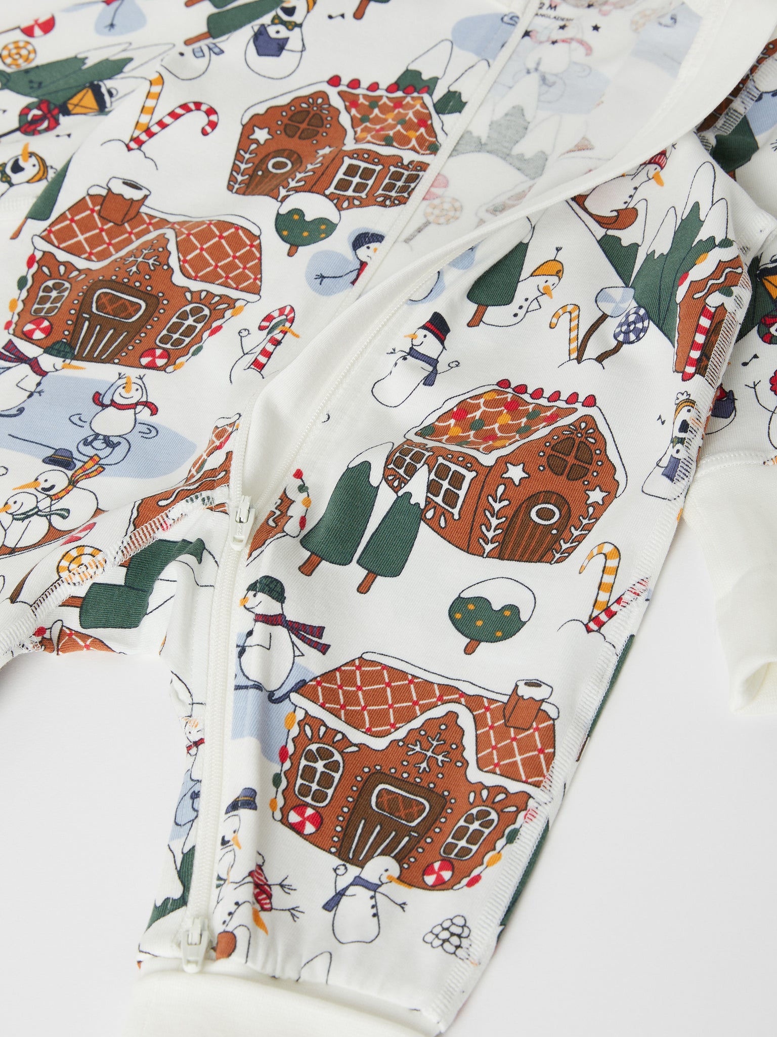 Gingerbread Print Cotton Sleepsuit from the Polarn O. Pyret baby collection. The best ethical baby clothes