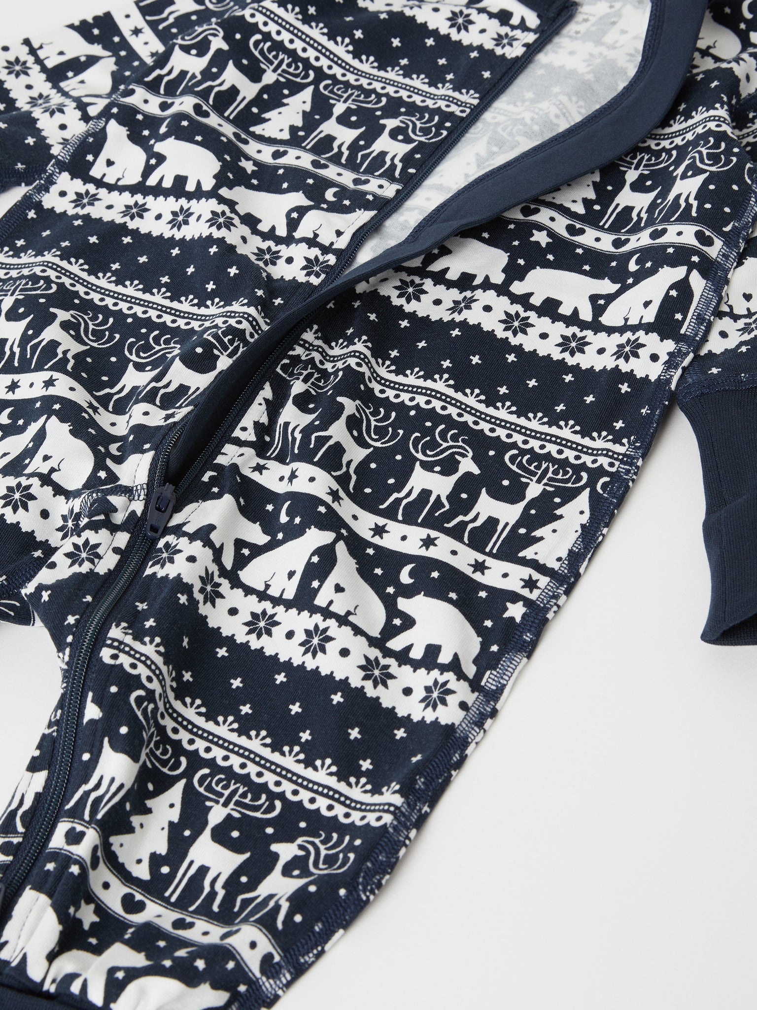 Reindeer Print Cotton Baby Sleepsuit from the Polarn O. Pyret baby collection. Nordic baby clothes made from sustainable sources.
