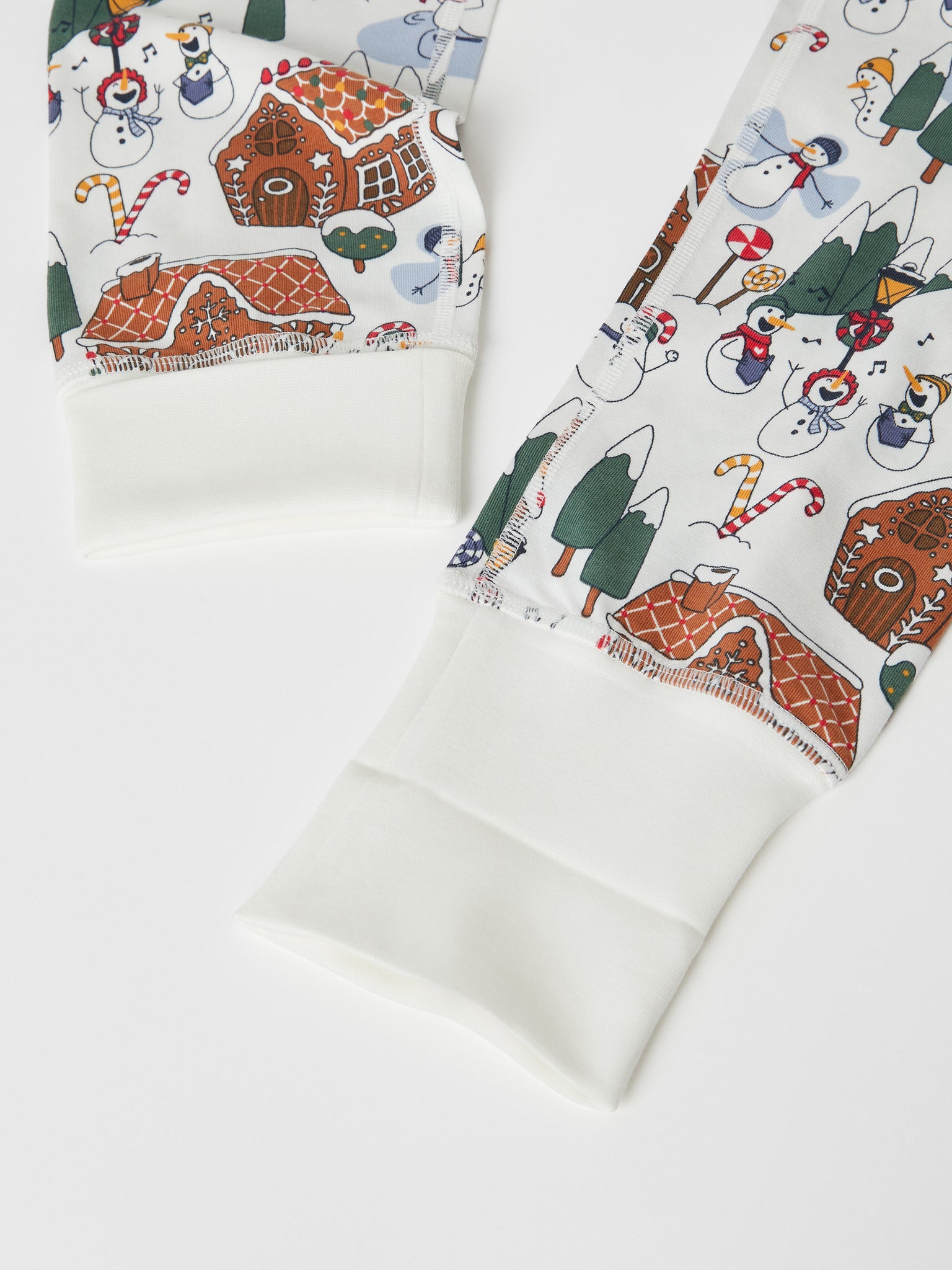 White Organic Kids Christmas Pyjamas from the Polarn O. Pyret kidswear collection. Ethically produced kids clothing.