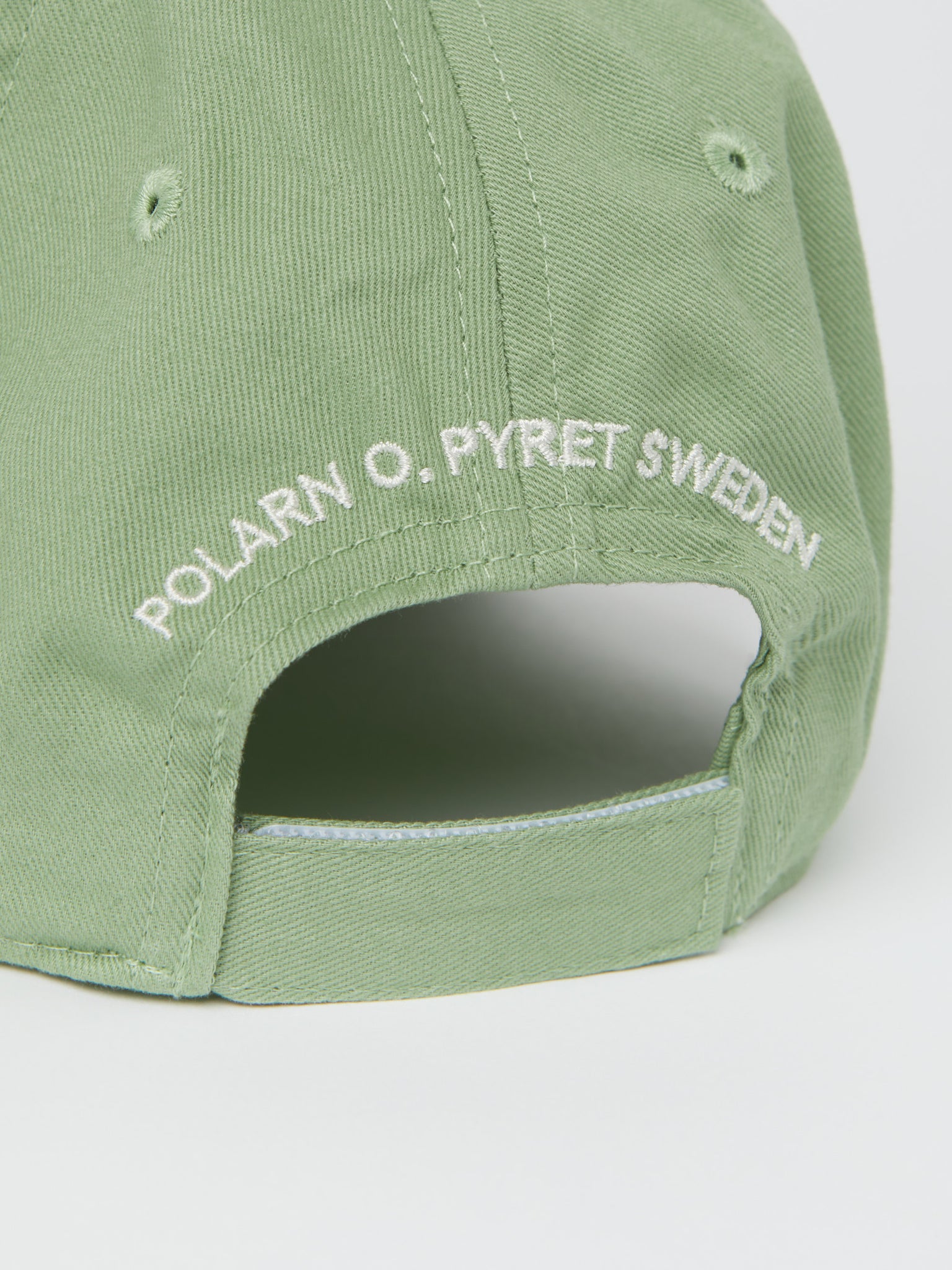 Kids Green Cotton Cap from the Polarn O. Pyret kidswear collection. Quality kids clothing made to last.