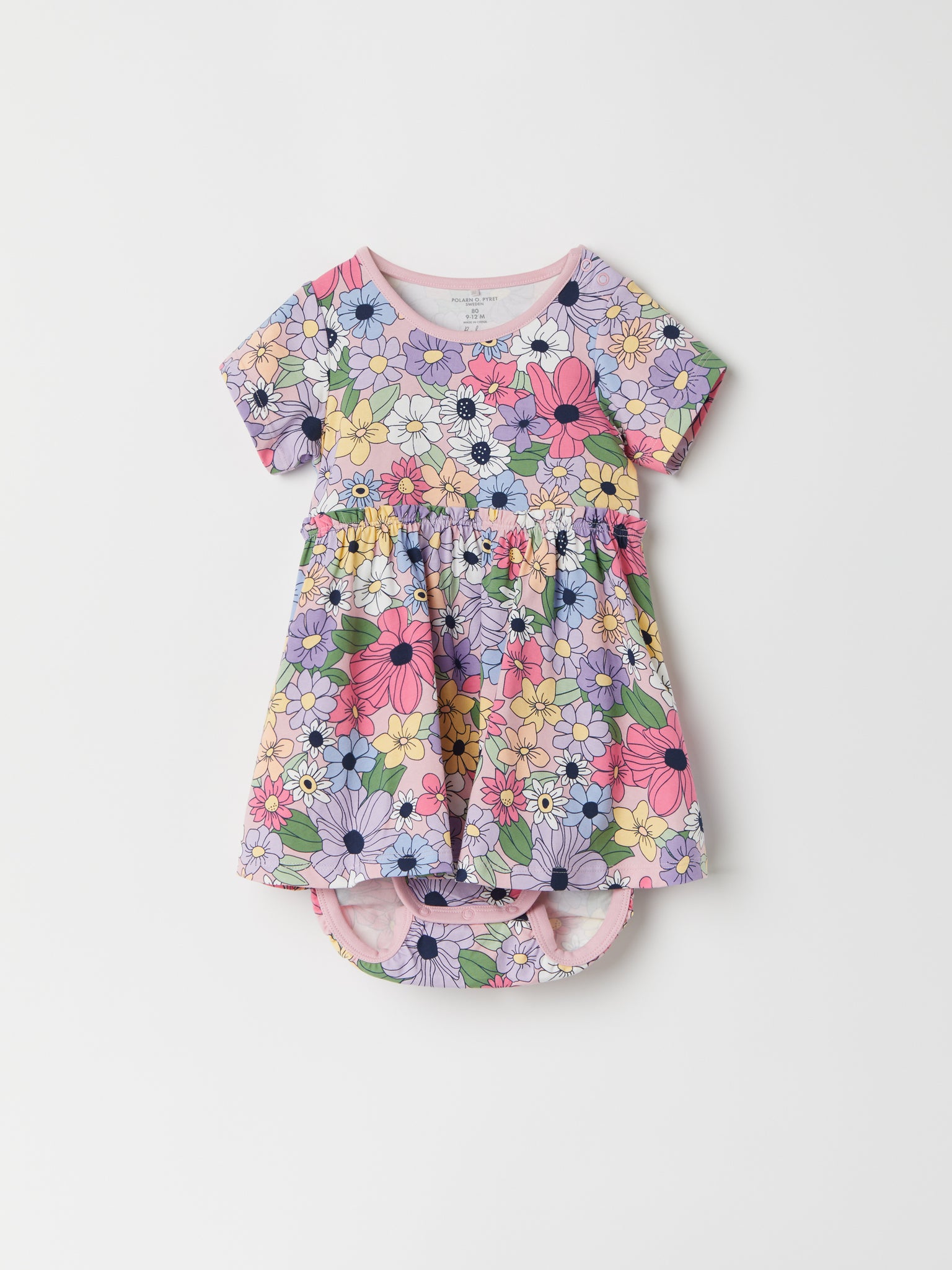 Floral Print Bodysuit & Dress from the Polarn O. Pyret baby collection. Nordic kids clothes made from sustainable sources.