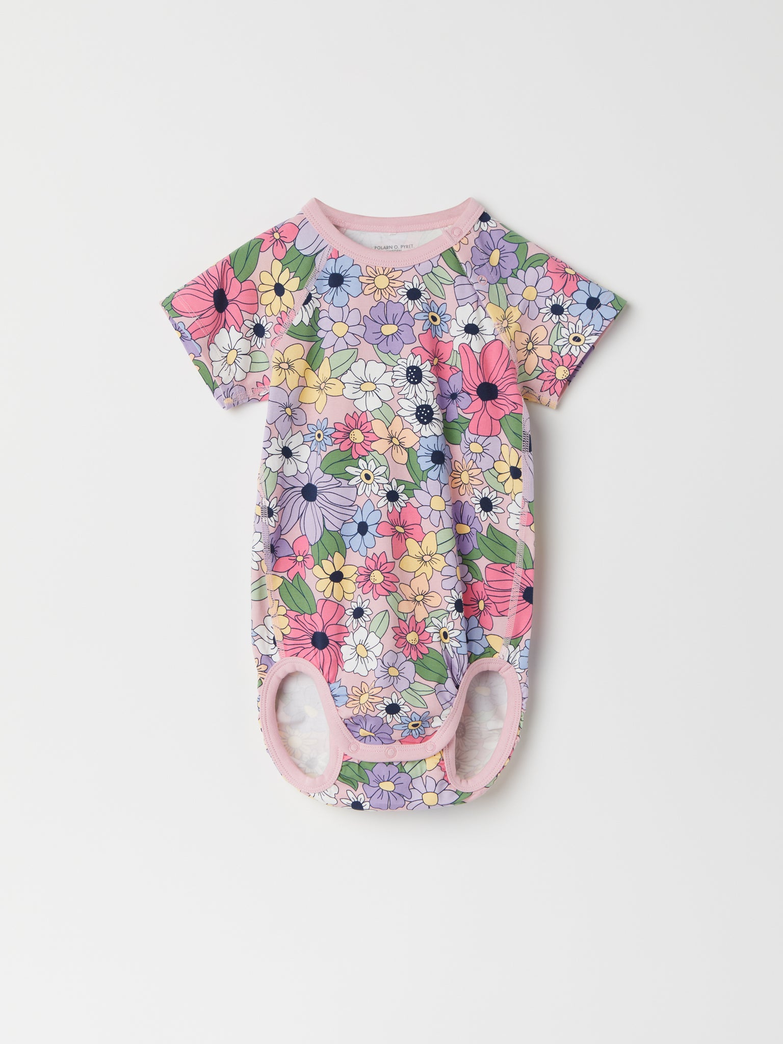 Floral Babygrow from the Polarn O. Pyret baby collection. Clothes made using sustainably sourced materials.