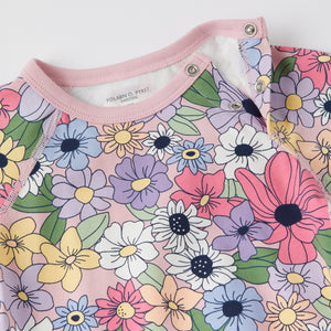 Floral Babygrow from the Polarn O. Pyret baby collection. Clothes made using sustainably sourced materials.