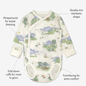 Organic cotton long sleeve babygrow in a unisex bunny print with text labels shown on the sides
