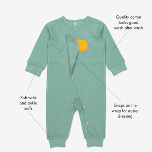 GOTS organic cotton baby wraparound all-in-one with sleeping bear applique with text labels shown on the sides