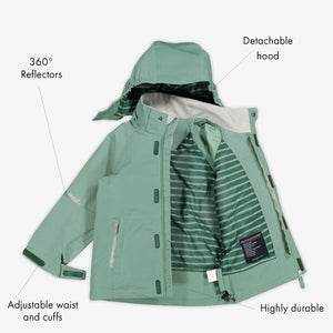 Lightweight kids waterproof jacket in colour green, includes a detachable hood, reflectors and adjustable waist and cuffs.