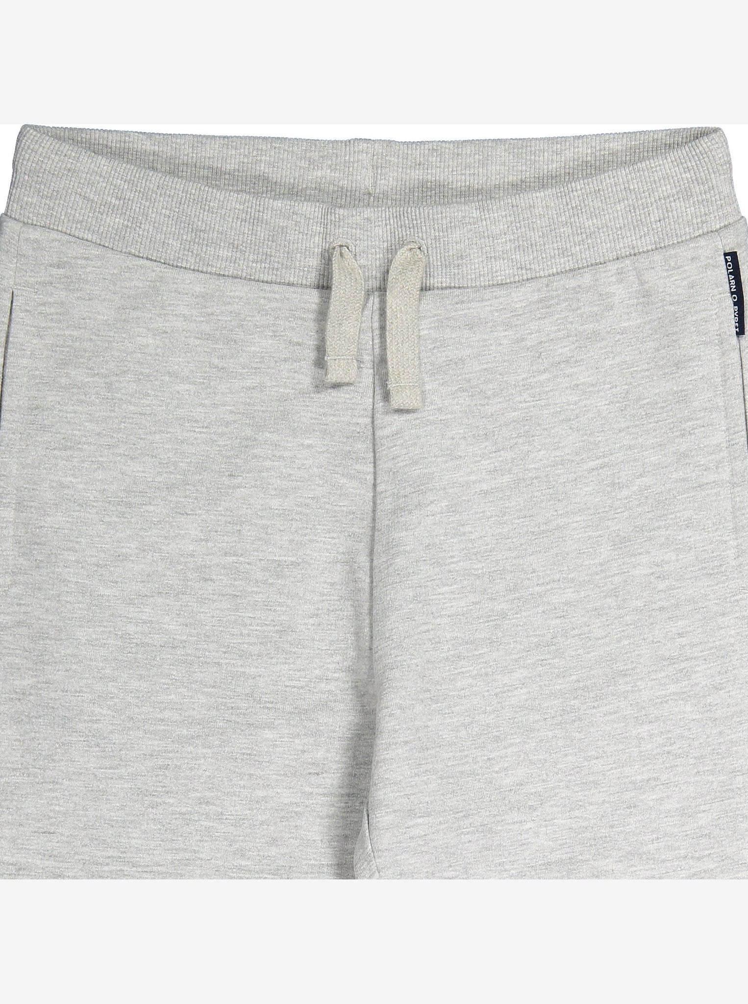 Close up of the elasticated waist & drawstring of a pair of grey joggers