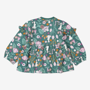 Back view woodland print top for baby girls with frilled shoulders, made from organic cotton fabric