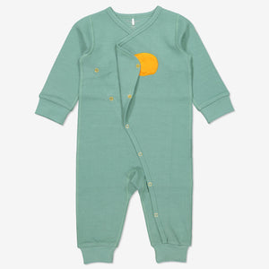Wraparound onesie for newborn babies in GOTS organic cotton with adorable sleeping bear applique. Open front showing full length popper fastenings for speedy changes. Quality ribbed trim for added comfort.