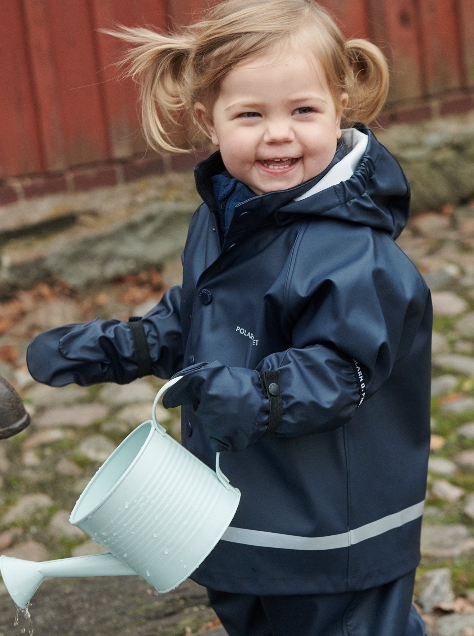 child in Waterproof Navy Blue Raincoat and bottoms