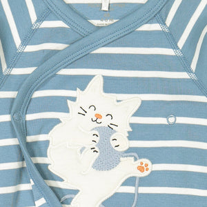 Close up of applique cat playing with ball on blue and white striped wraparound newborn babygrow.