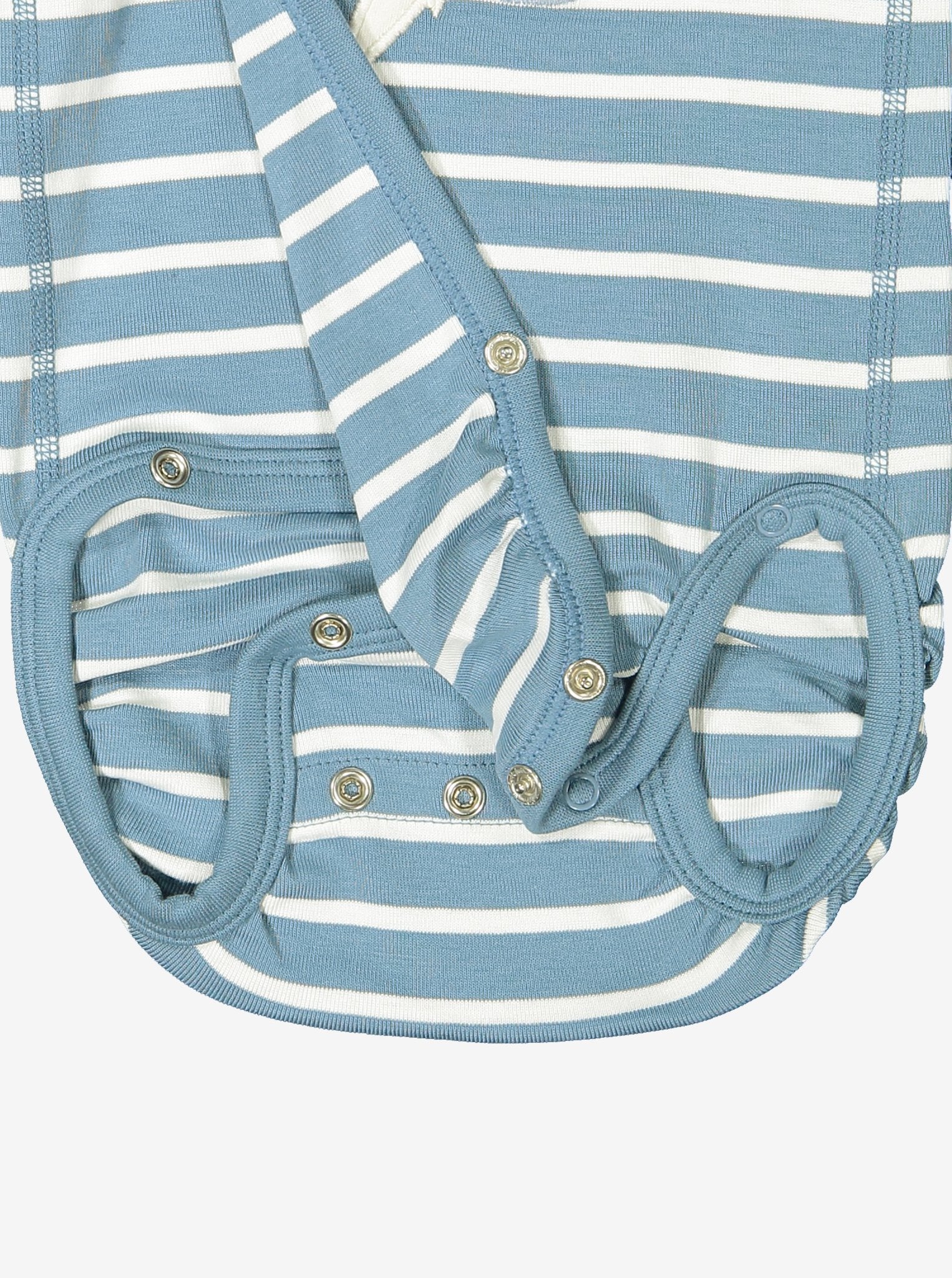 Close up of unisex blue and white striped wraparound organic cotton newborn babygrow showing easy popper fastening for speedy changes