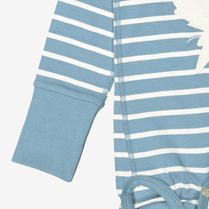 Blue and white striped babygrow showing close of of unique fold-over cuffs giving lots of growing room