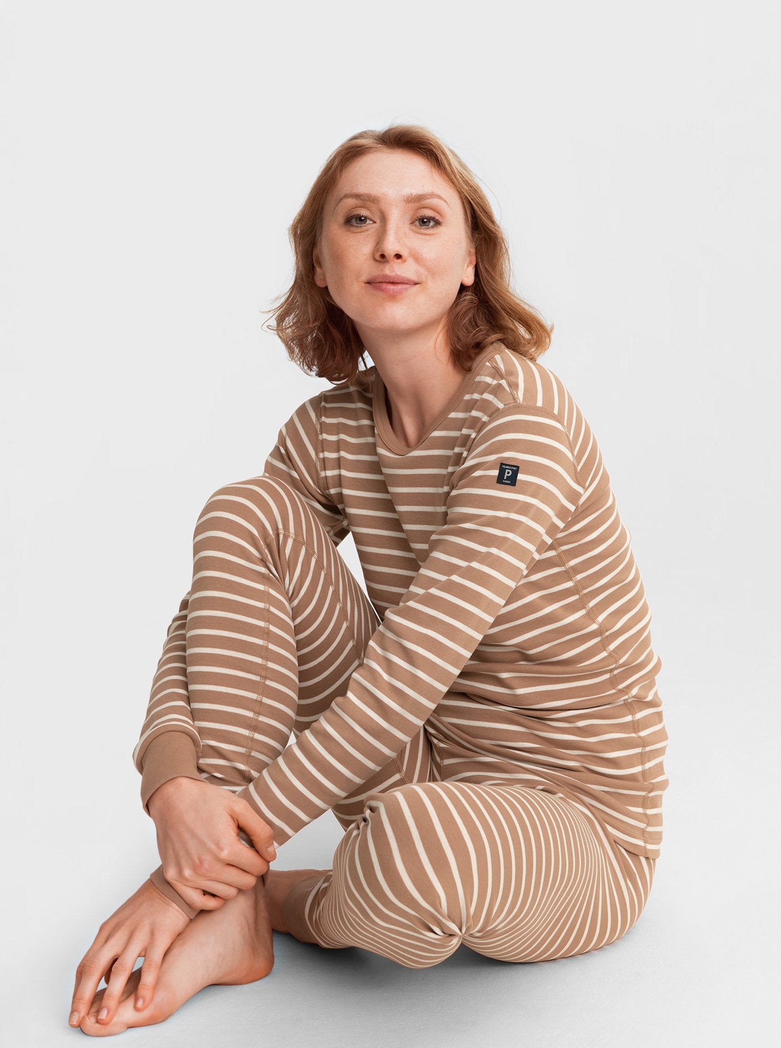  Oganic Striped Brown Adult Pyjamas from Polarn O. Pyret Kidswear. Made with 100% organic cotton.