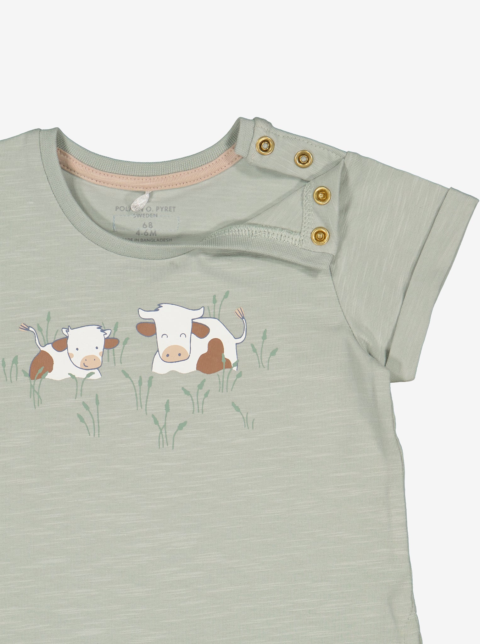 Cow Print Green Baby T-Shirt from Polarn O. Pyret Kidswear. Made using sustainable sourced materials.