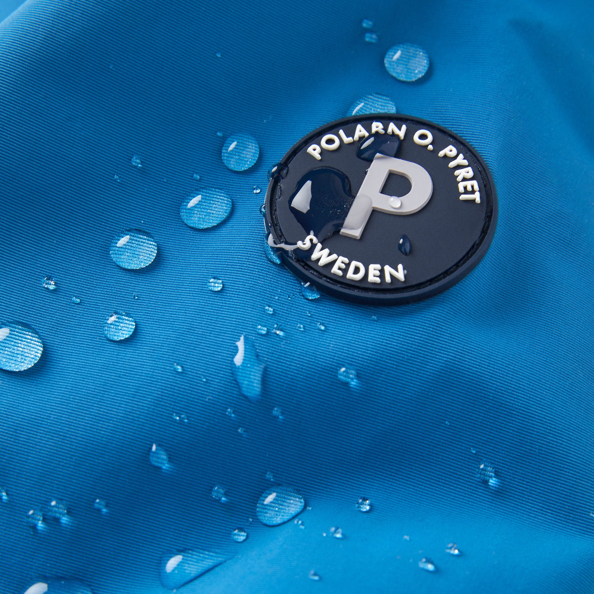 Blue Kids Waterproof Shell Jacket from the Polarn O. Pyret kidswear collection. The best ethical kids outerwear.