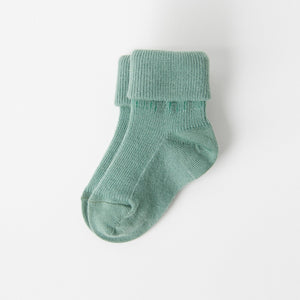Green Merino Wool Baby Socks from the Polarn O. Pyret kidswear collection. Ethically produced kids outerwear.