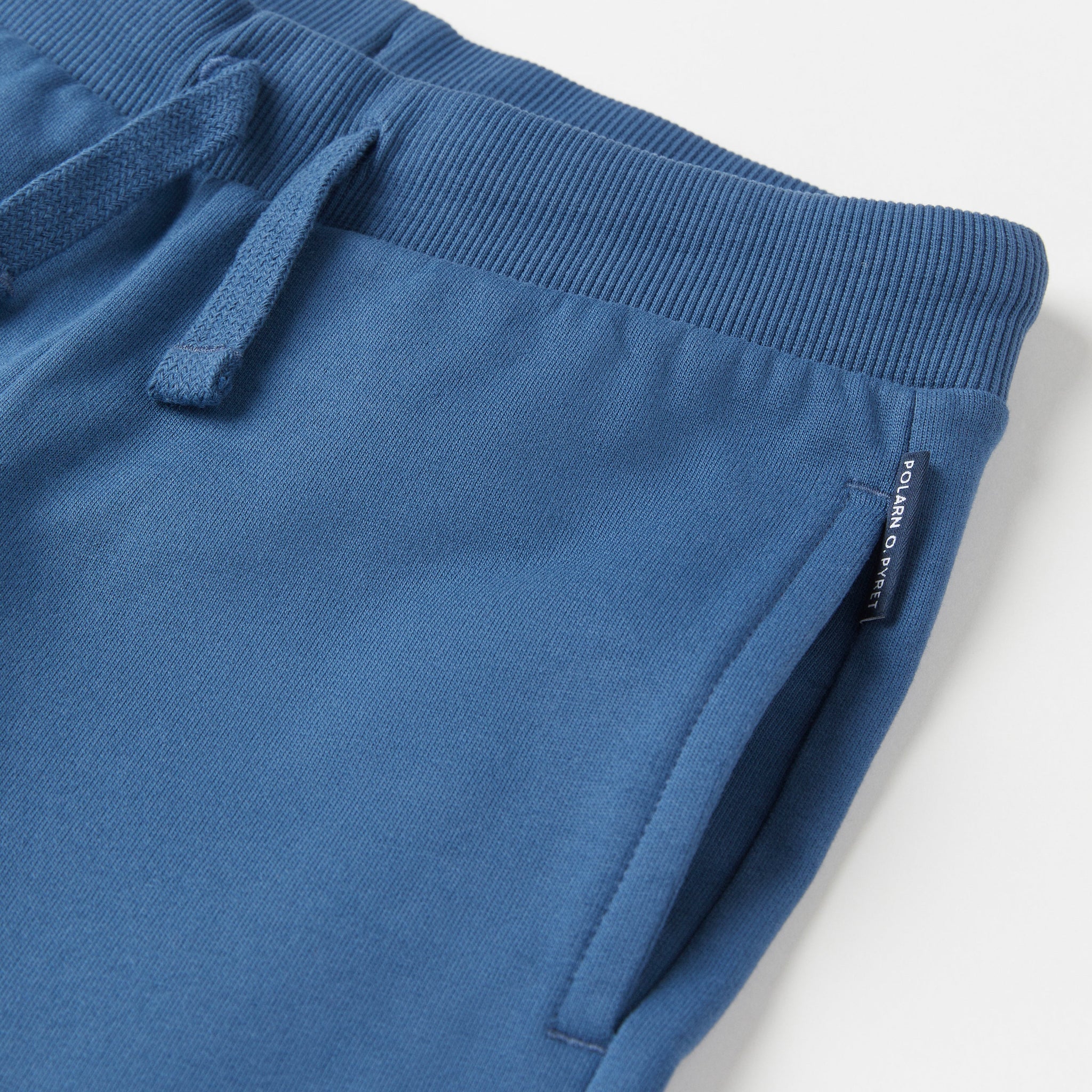 Organic Cotton Blue Kids Joggers from the Polarn O. Pyret Kidswear collection. Nordic kids clothes made from sustainable sources.