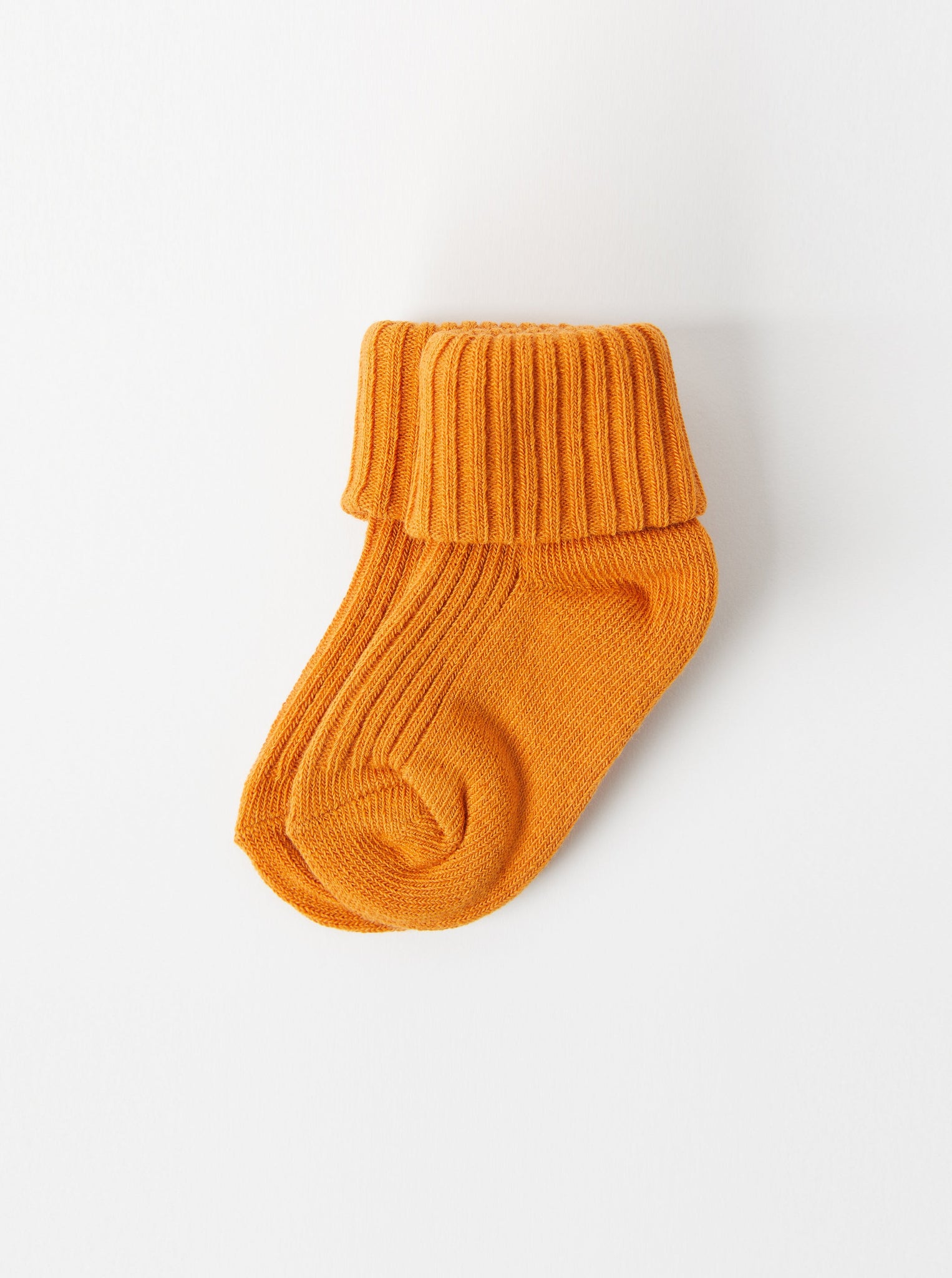 Organic Cotton Yellow Baby Socks from the Polarn O. Pyret Kidswear collection. Clothes made using sustainably sourced materials.