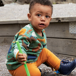 Green Dinosaur Kids Top from the Polarn O. Pyret Kidswear collection. Clothes made using sustainably sourced materials.