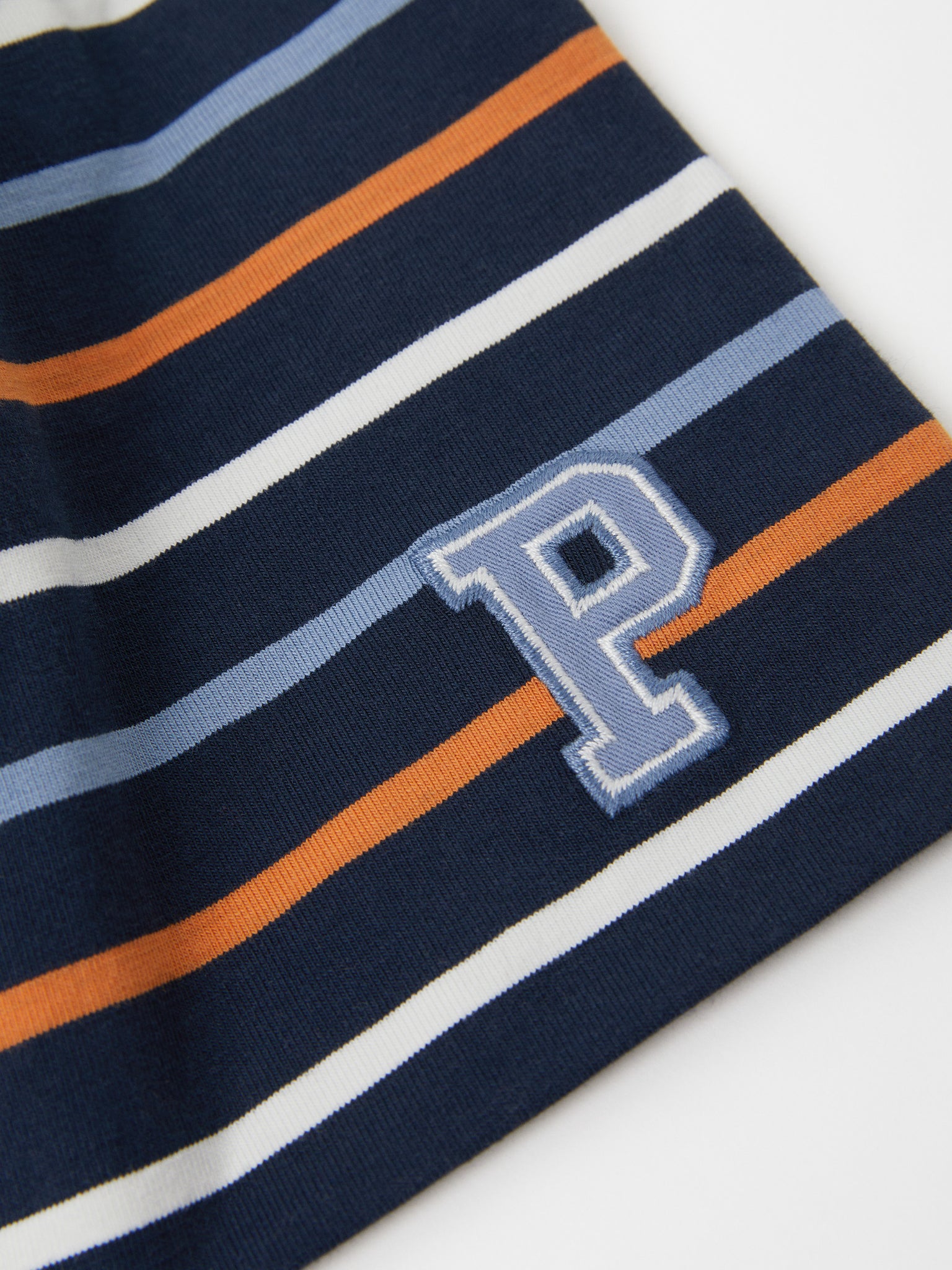 Striped Navy Kids Beanie Hat from the Polarn O. Pyret outerwear collection. Made using ethically sourced materials.