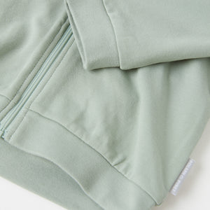 Organic Cotton Green Baby Hoodie from the Polarn O. Pyret baby collection. Ethically produced baby clothing.