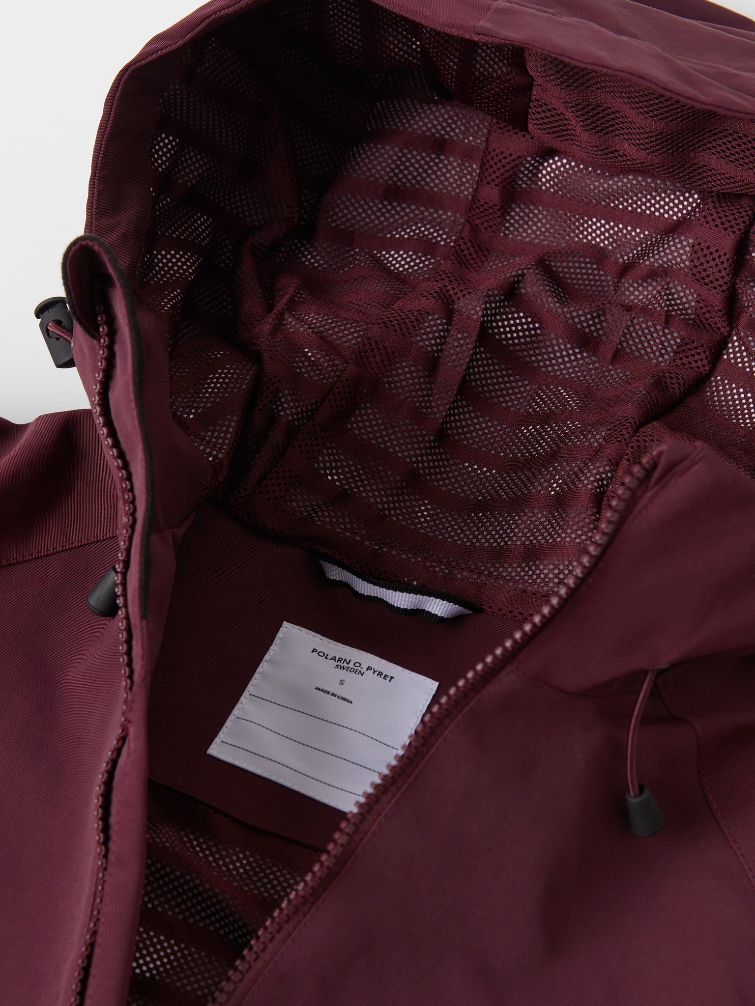 Burgundy Adult Waterproof Shell Jacket from the Polarn O. Pyret outerwear collection. The best ethical kids outerwear.