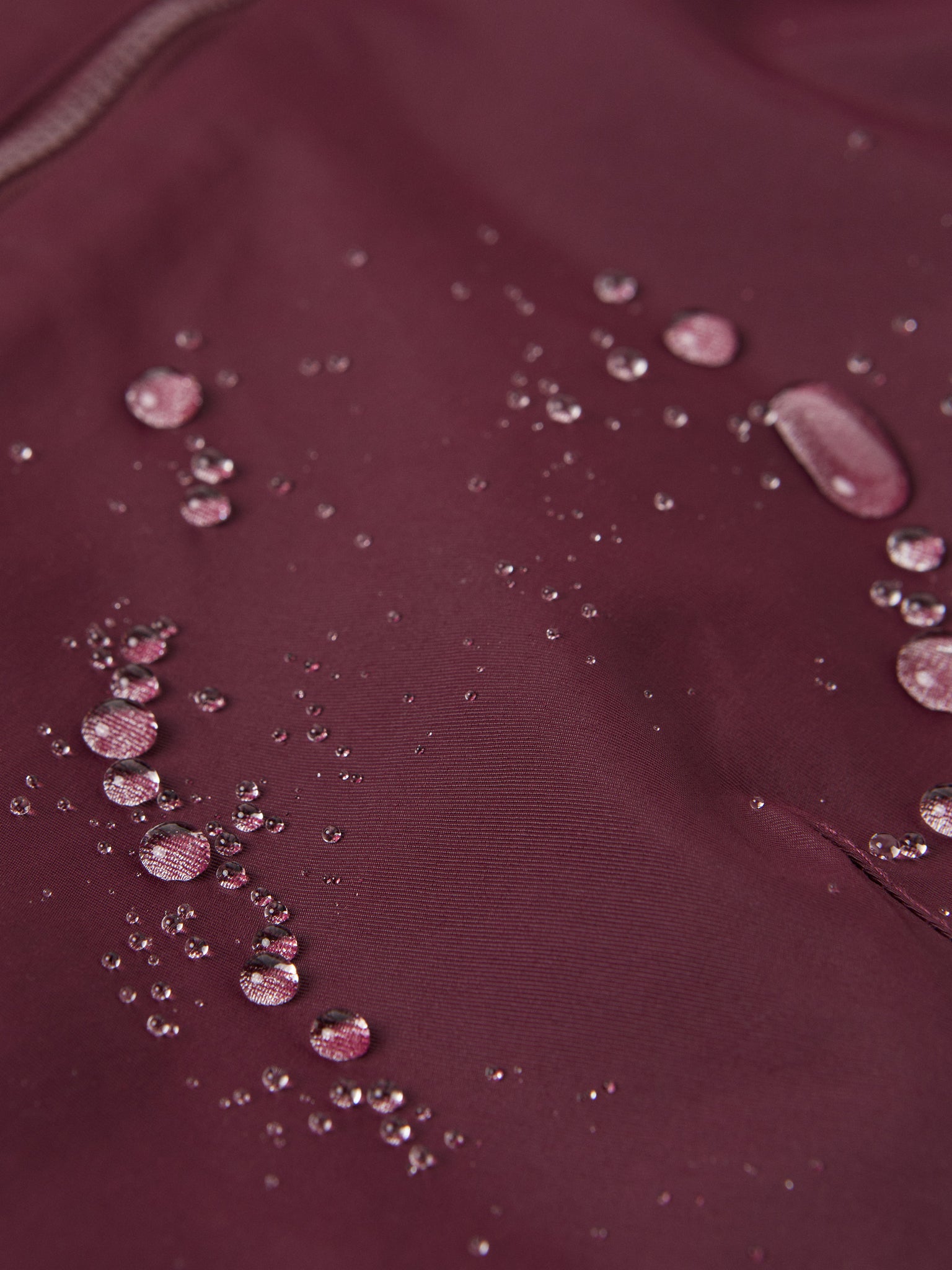 Burgundy Adult Waterproof Shell Jacket from the Polarn O. Pyret outerwear collection. The best ethical kids outerwear.