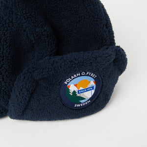 Merino Wool Navy Kids Bobble Hat from the Polarn O. Pyret outerwear collection. Made using ethically sourced materials.