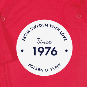 White round logo with 'From Sweden With Love, Since 1976" text, shown on a red organic cotton babygrow background.